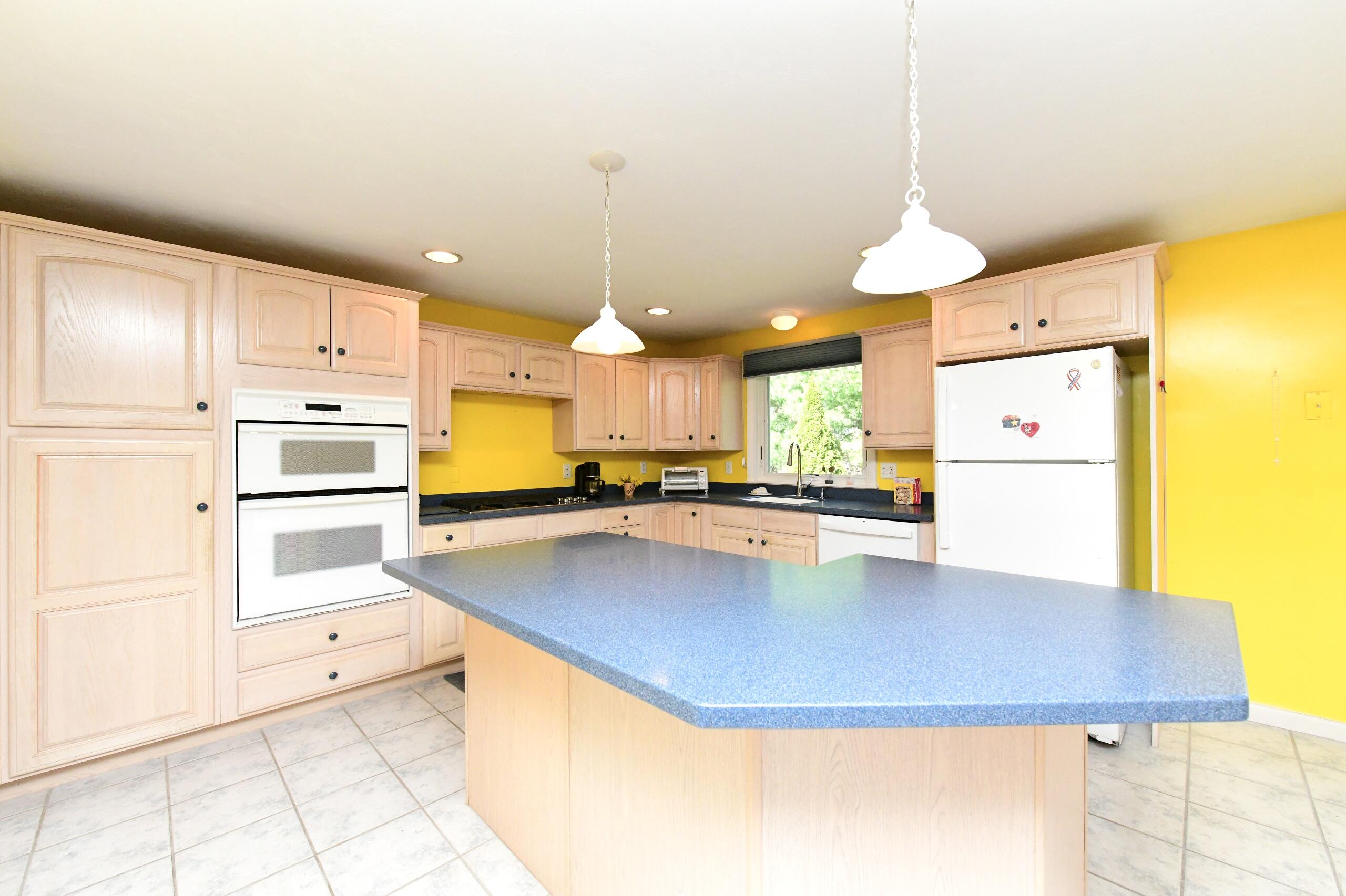 25 Andrew Road Sagamore Beach, MA 02562 - Photo 7 of 45 a kitchen with stainless steel appliances granite countertop a sink a stove and a refrigerator