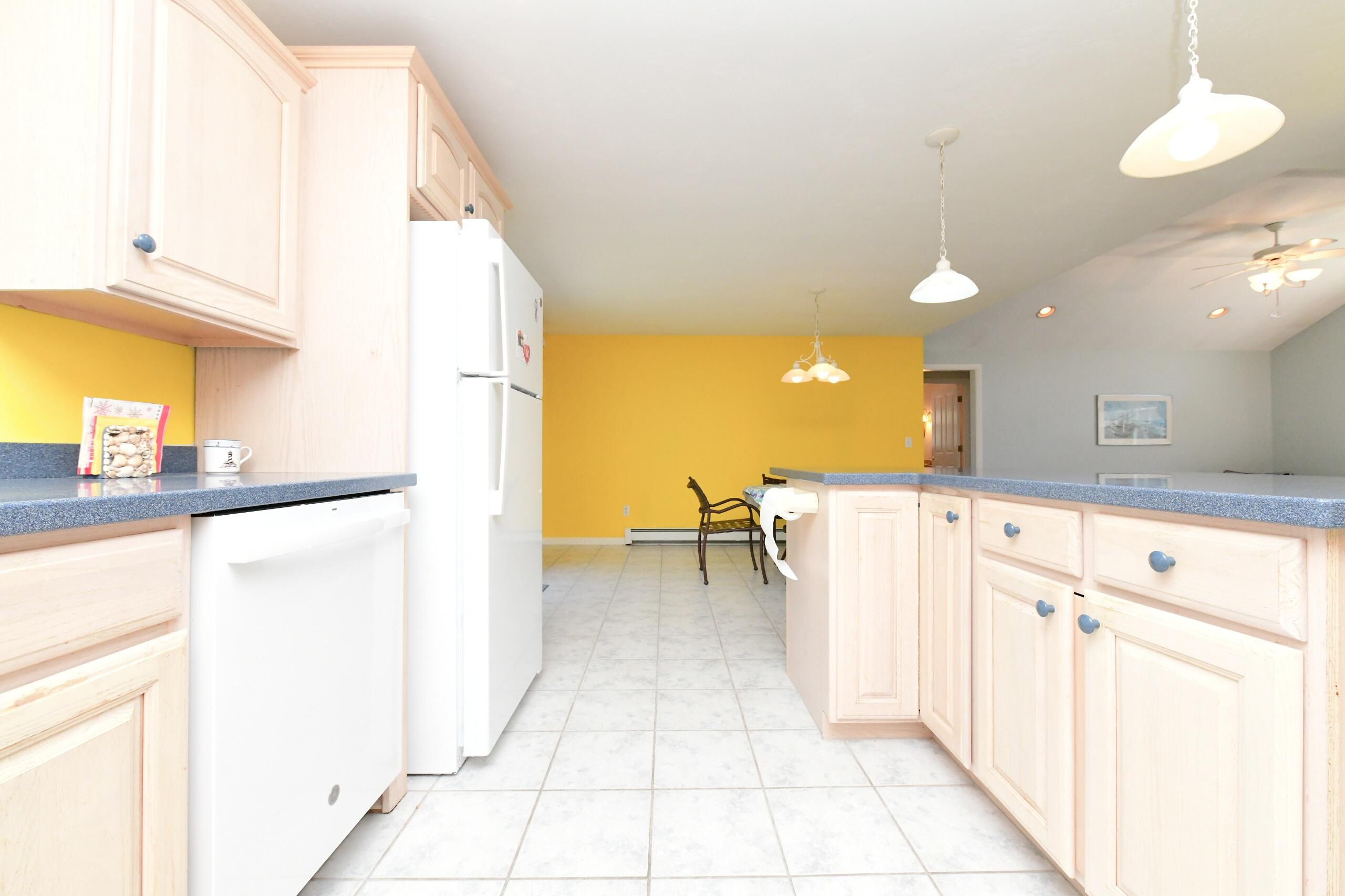 25 Andrew Road Sagamore Beach, MA 02562 - Photo 8 of 45 a kitchen with a refrigerator and countertop