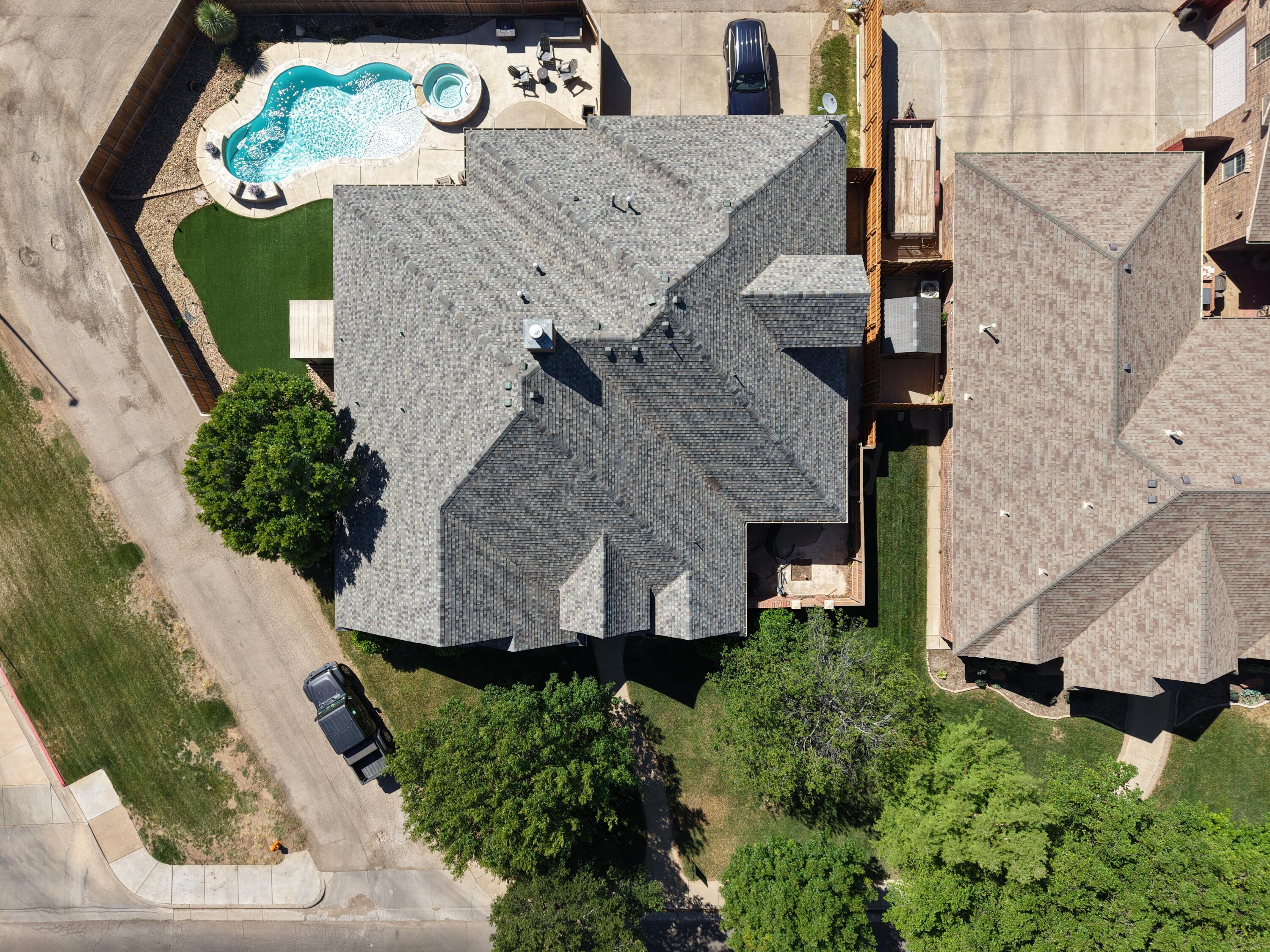 5008 Wesley Road Amarillo, TX 79119 - Photo 47 of 47 an aerial view of a house with a swimming pool