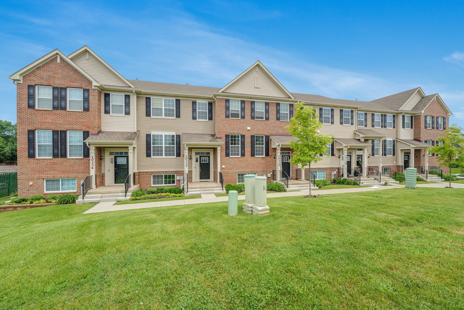 10332 Kerry Ridge Court Chicago Ridge, IL 60415 - Photo 1 of 19 a front view of a residential apartment building with a yard