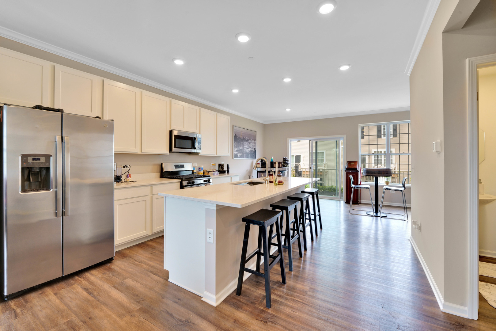 10332 Kerry Ridge Court Chicago Ridge, IL 60415 - Photo 6 of 19 a kitchen with kitchen island white cabinets and stainless steel appliances