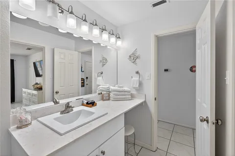 a bathroom with a sink double vanity and a mirror