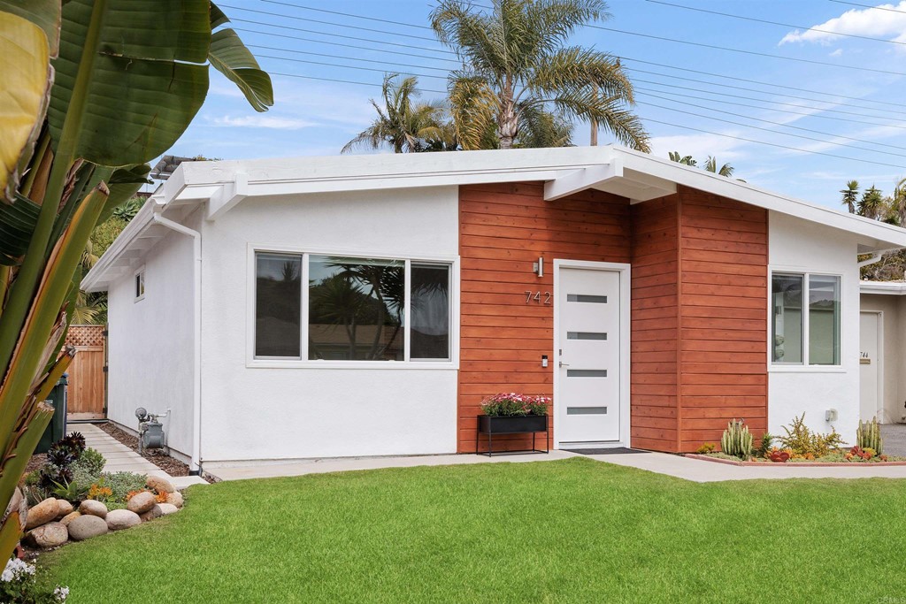 742 Snapdragon Street Encinitas, CA 92024 - Photo 1 of 22 a front view of a house with a yard