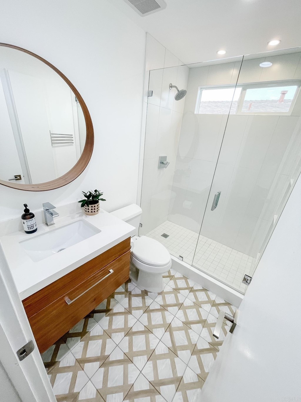 742 Snapdragon Street Encinitas, CA 92024 - Photo 11 of 22 a bathroom with a sink a toilet and a mirror