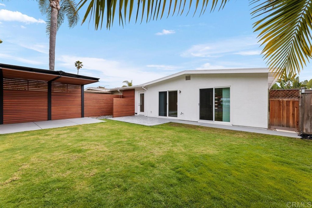 742 Snapdragon Street Encinitas, CA 92024 - Photo 20 of 22 a view of a backyard with a garden and plants