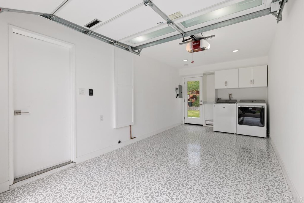 742 Snapdragon Street Encinitas, CA 92024 - Photo 21 of 22 a view of a kitchen with a sink and a refrigerator