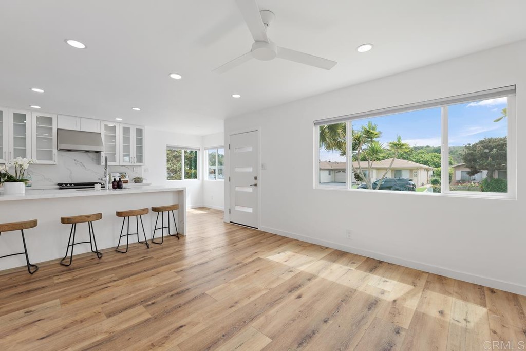 742 Snapdragon Street Encinitas, CA 92024 - Photo 8 of 22 a view of kitchen with kitchen island wooden floors and center island