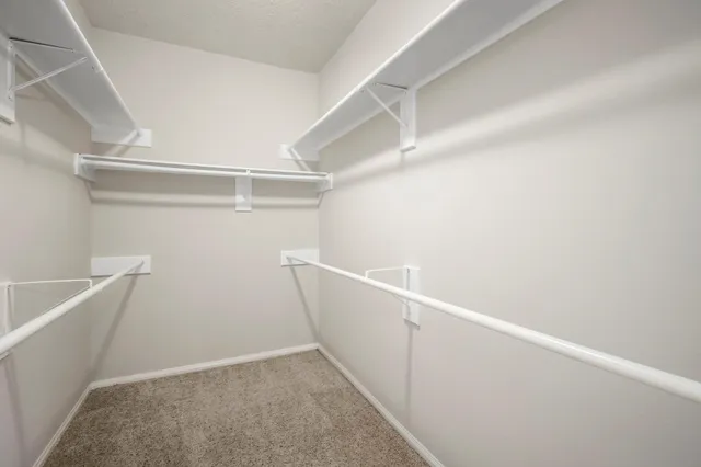a view of an empty walk in closet