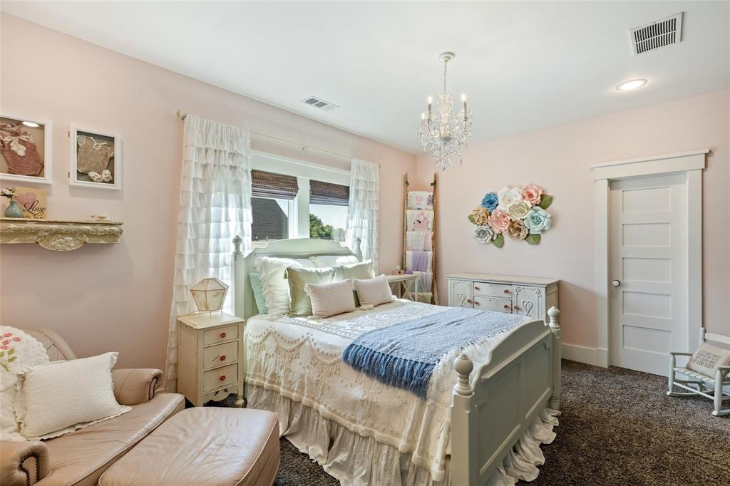 1109 East Oakdale Road Irving, TX 75060 - Photo 29 of 33 a bedroom with a bed and wooden floor