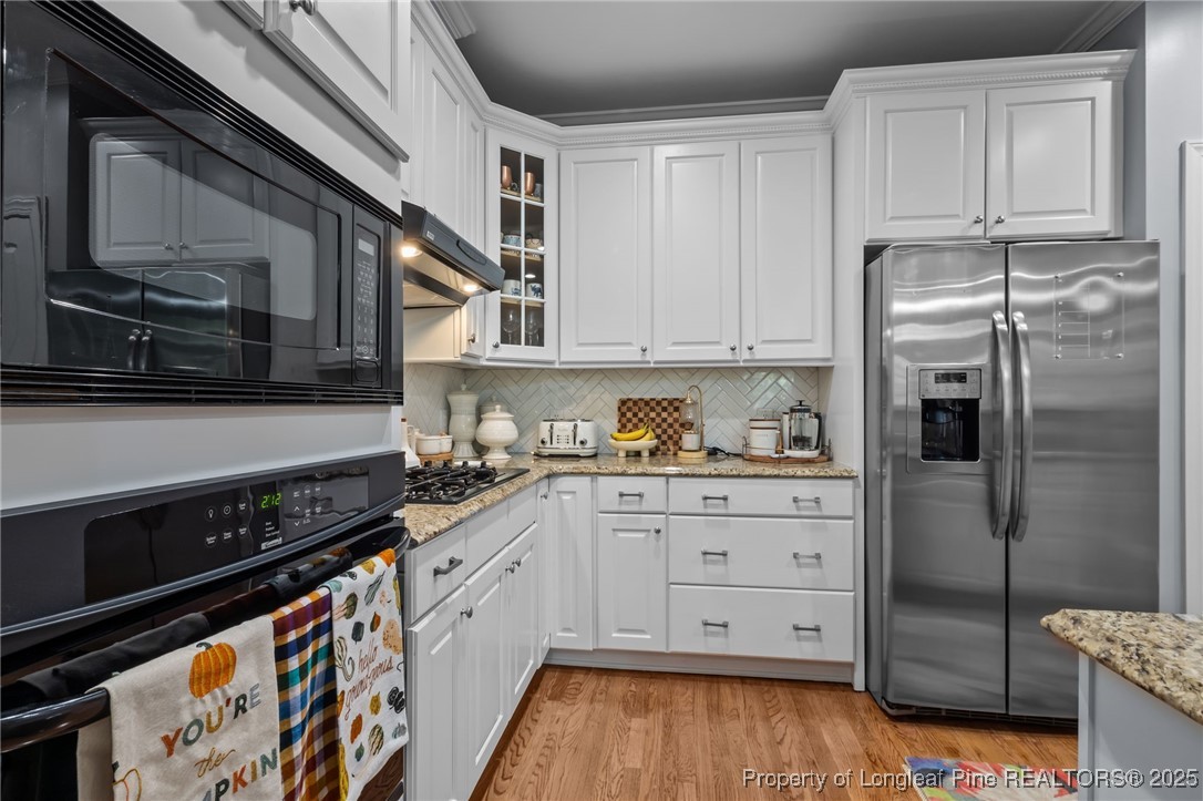 47 Abernathy Drive, Unit 13 Chapel Hill, NC 27517 - Photo 13 of 46 a kitchen with stainless steel appliances granite countertop a refrigerator and a stove top oven