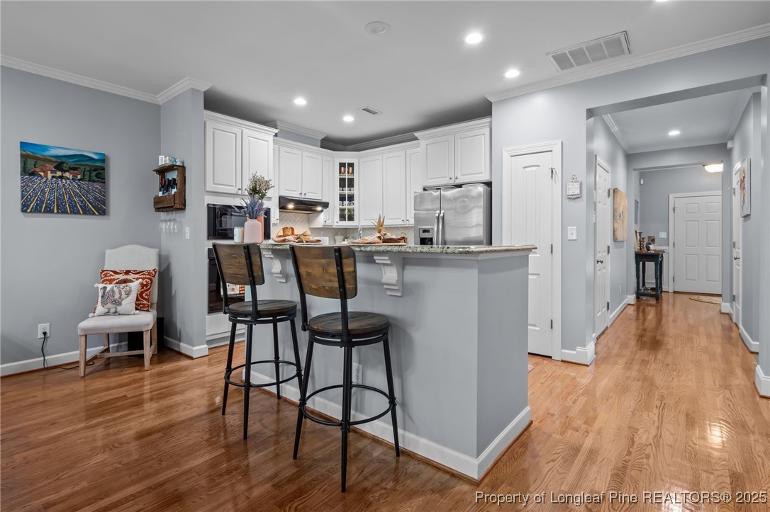47 Abernathy Drive, Unit 13 Chapel Hill, NC 27517 - Photo 16 of 46 a view of a dining room with furniture and wooden floor