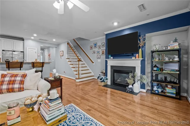 a bedroom with a bed and a flat tv screen on dresser