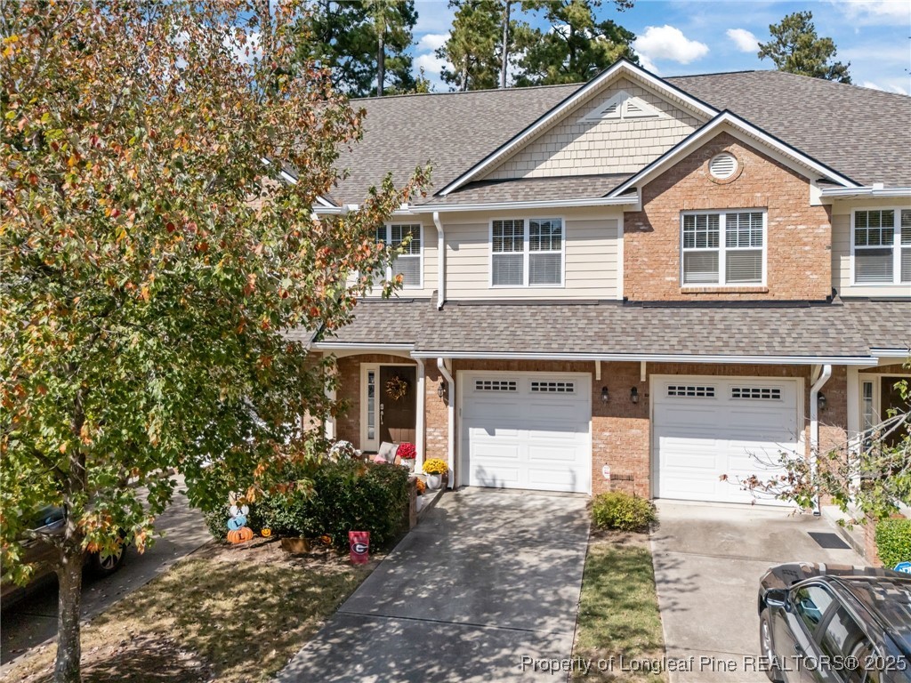 47 Abernathy Drive, Unit 13 Chapel Hill, NC 27517 - Photo 2 of 46 a front view of a house with a yard and garage