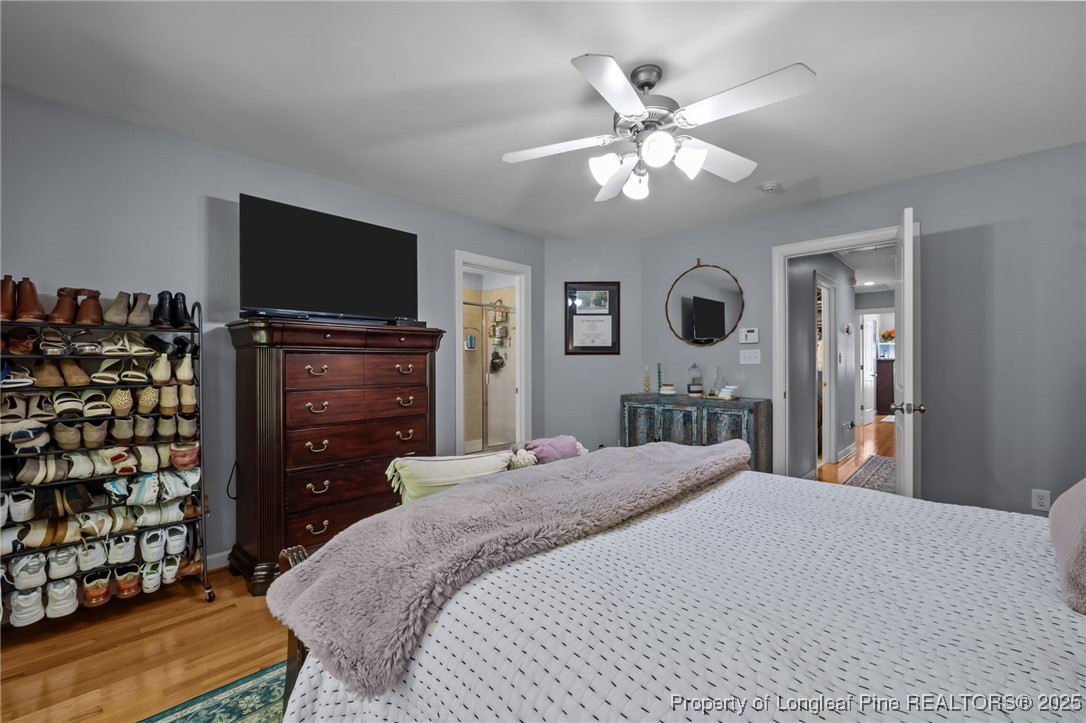 47 Abernathy Drive, Unit 13 Chapel Hill, NC 27517 - Photo 22 of 46 a bedroom with a bed and a flat tv screen on dresser