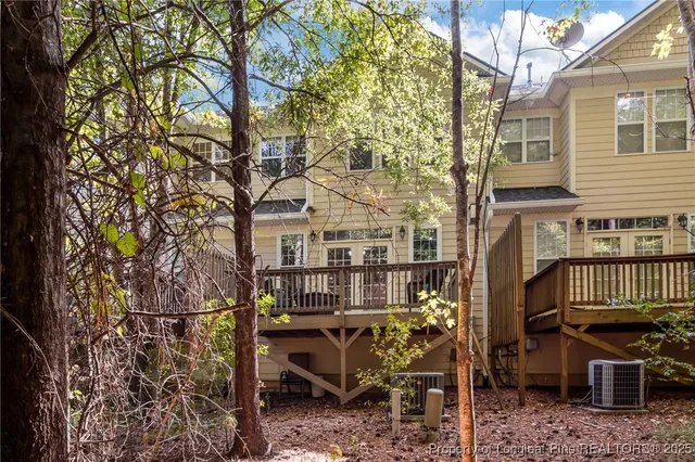 an aerial view of a house with yard swimming pool and outdoor seating