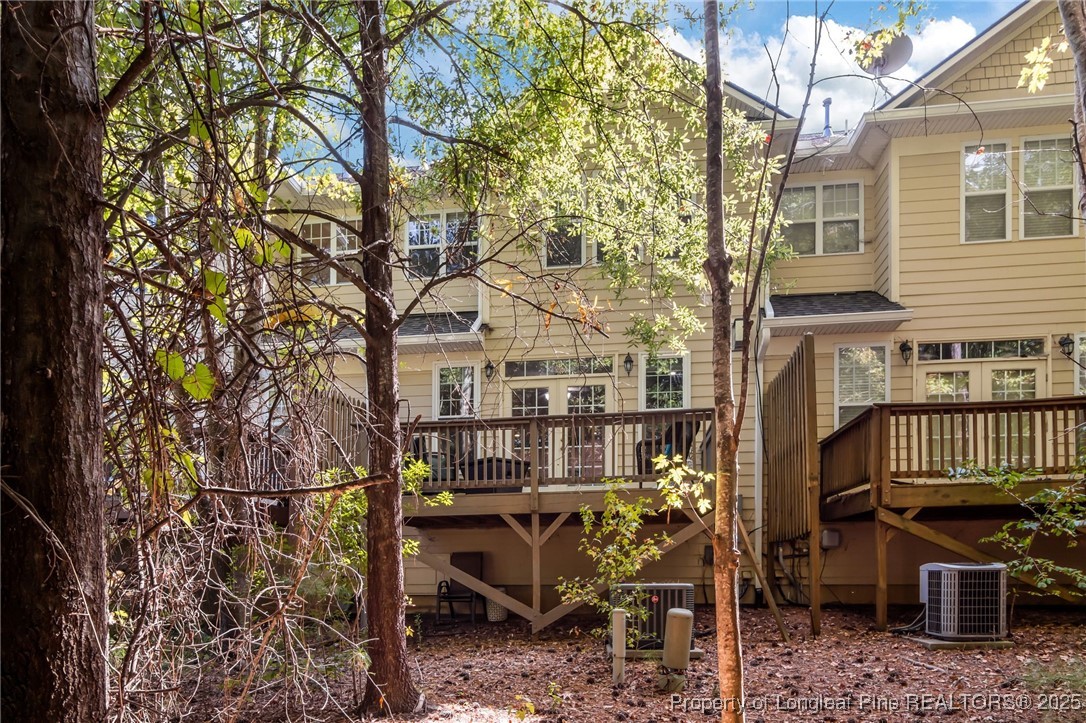 47 Abernathy Drive, Unit 13 Chapel Hill, NC 27517 - Photo 36 of 46 a view of a chair and table in the back yard of the house