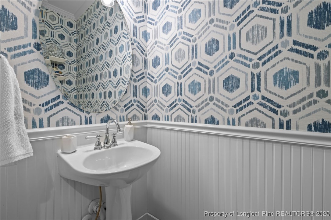 47 Abernathy Drive, Unit 13 Chapel Hill, NC 27517 - Photo 10 of 46 a bathroom with a sink and a mirror