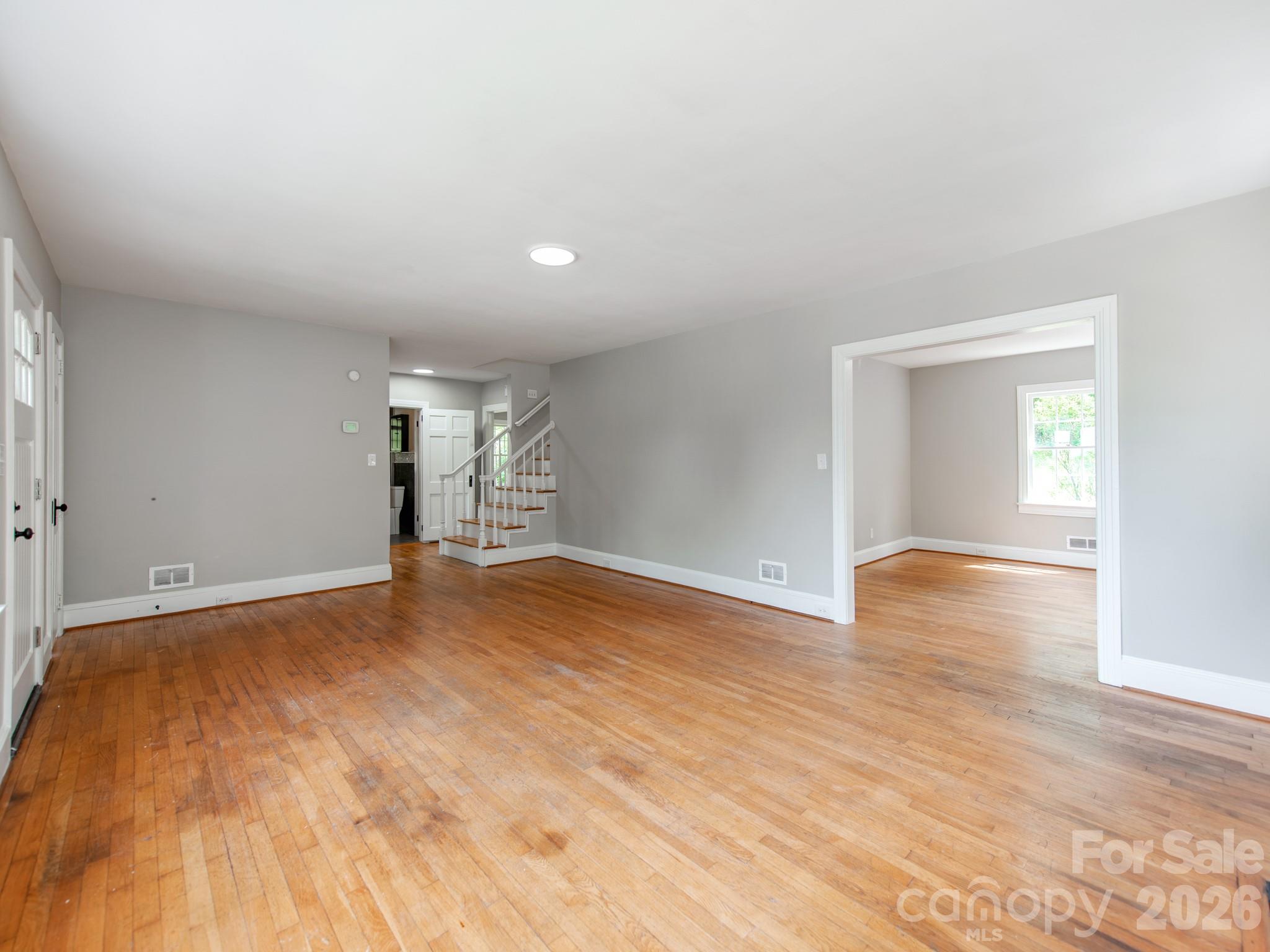 113 Falls Street Morganton, NC 28655 - Photo 7 of 33 a view of empty room with wooden floor