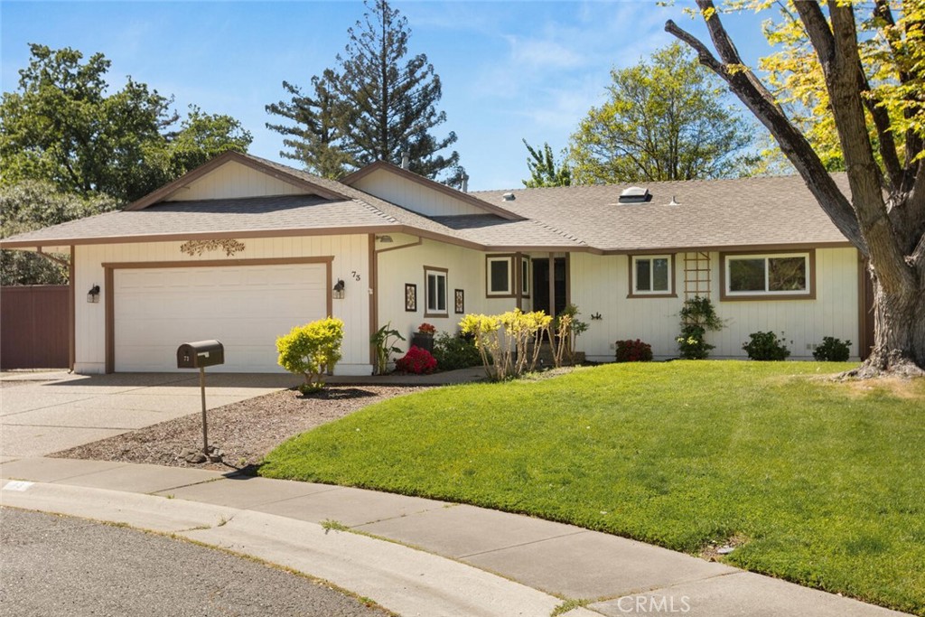 a front view of house with yard and outdoor seating
