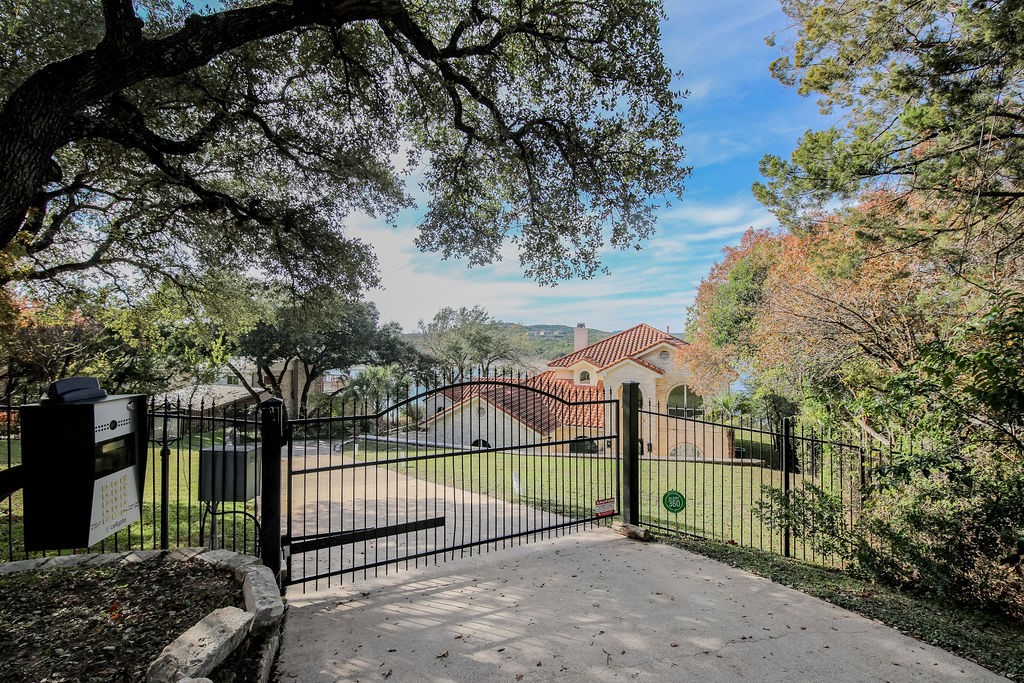 a view of a wrought iron fences in front of house