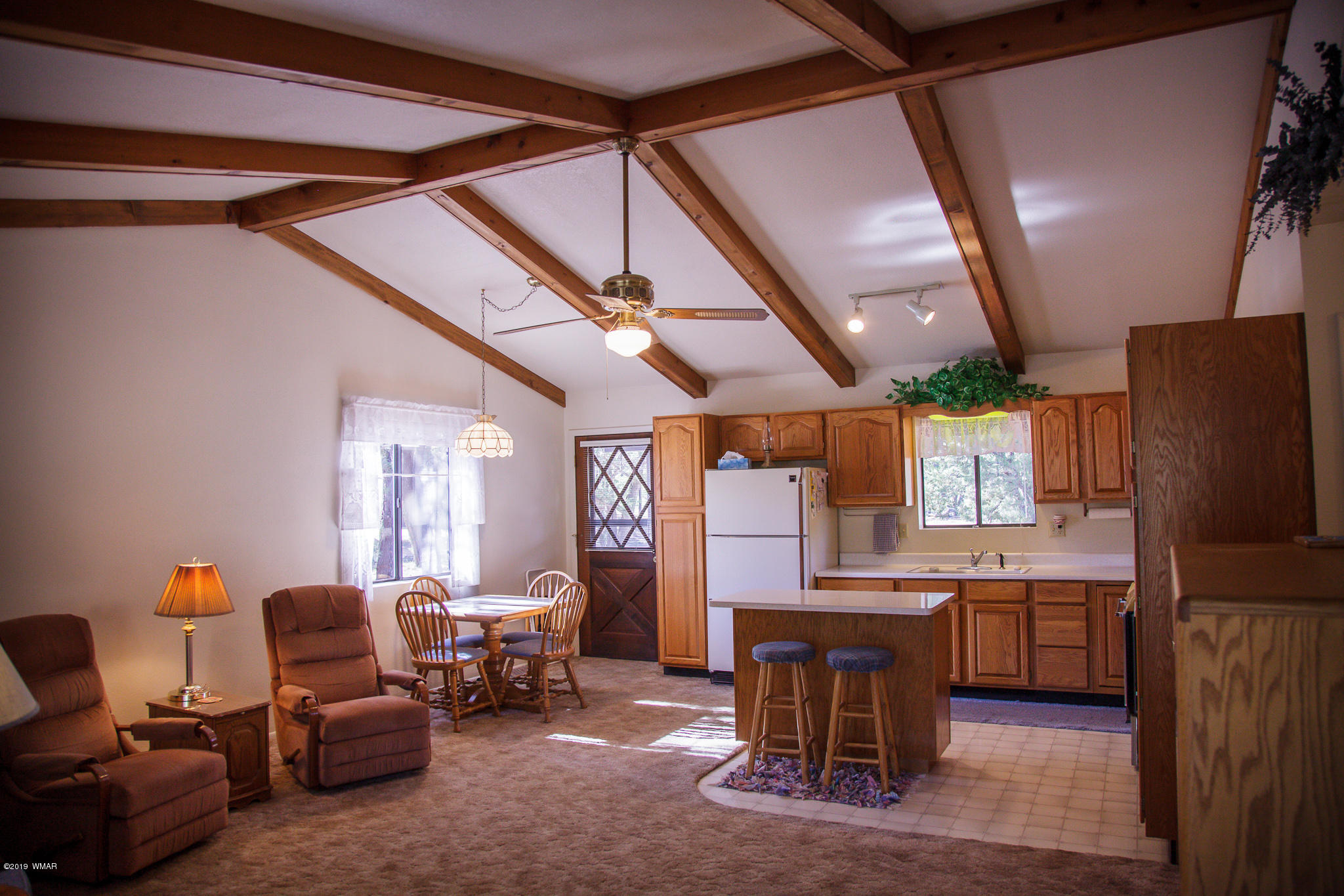 3112 Chevelon Road Overgaard, AZ 85933 - Photo 3 of 18 a living room with furniture and kitchen view