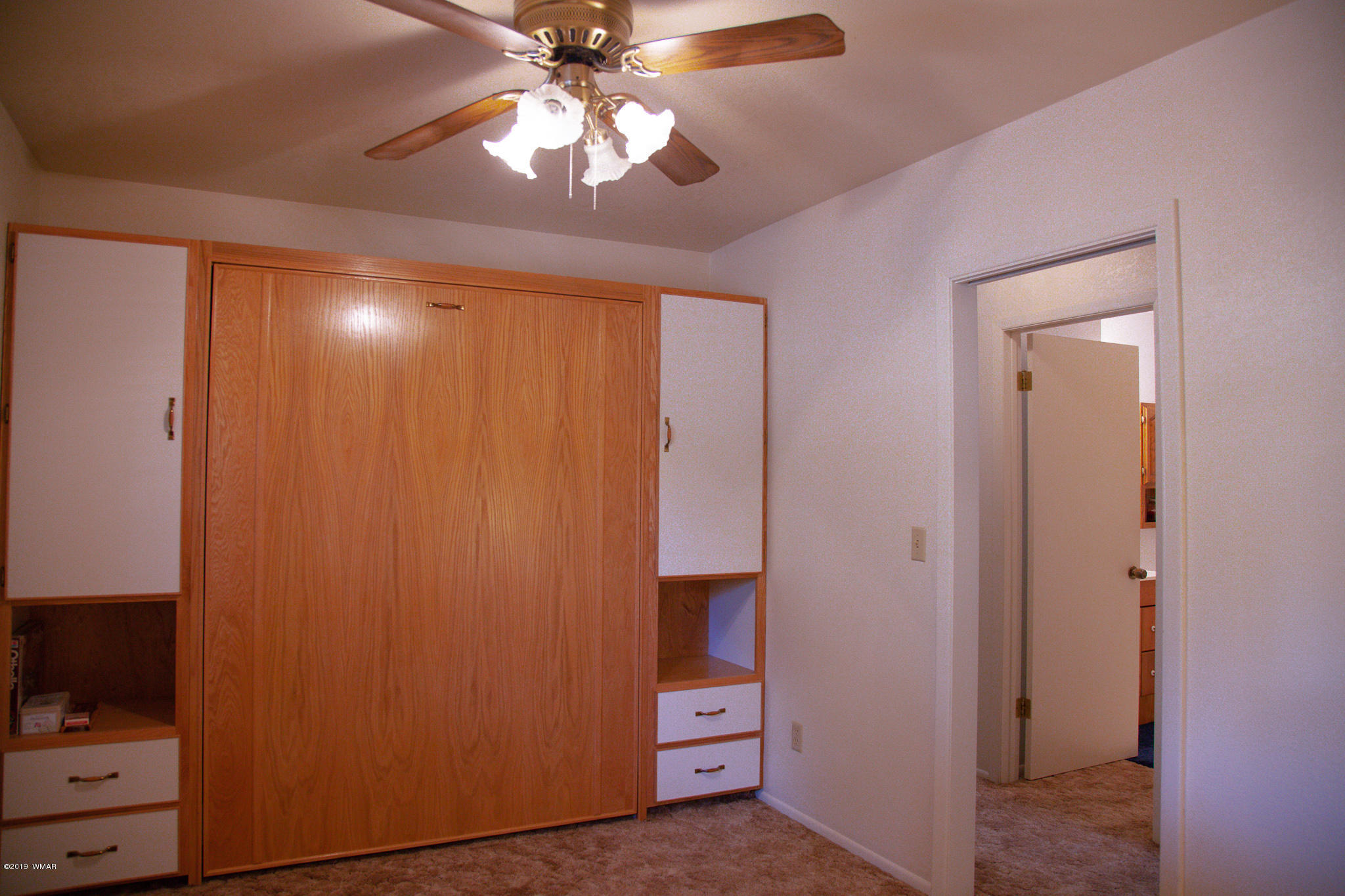 3112 Chevelon Road Overgaard, AZ 85933 - Photo 8 of 18 wooden floor in an empty room