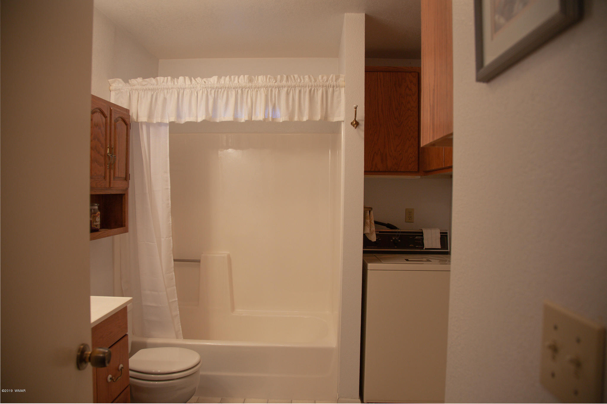 3112 Chevelon Road Overgaard, AZ 85933 - Photo 9 of 18 a bathroom with a sink toilet and shower