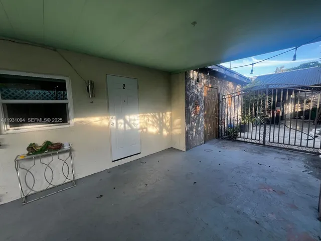 a view of empty room with windows