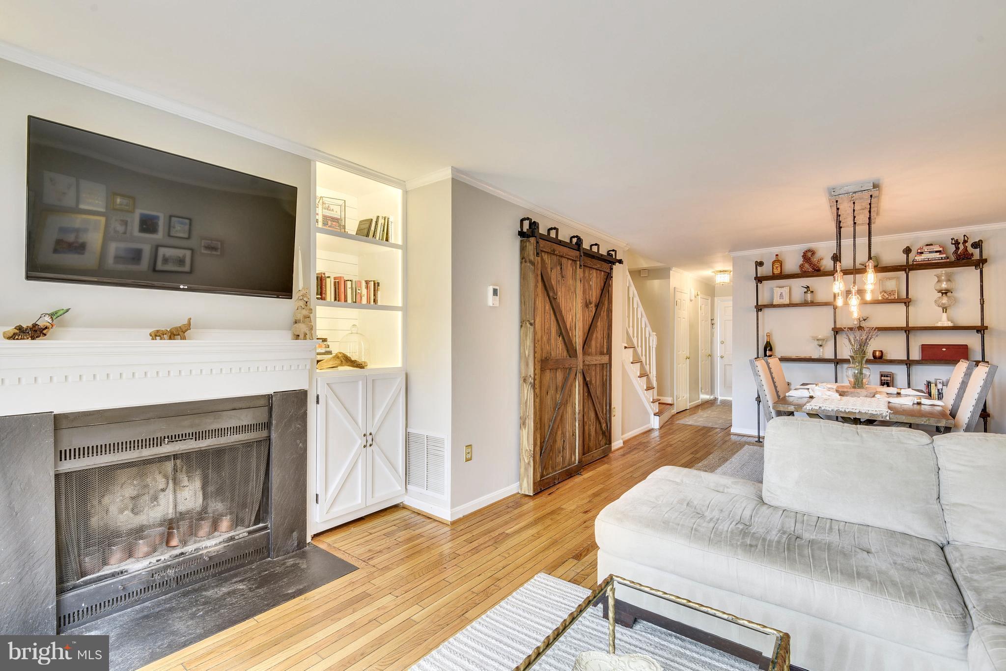 320 Commerce Street Alexandria, VA 22314 - Photo 8 of 30 Living Room w/wood burning fireplace
