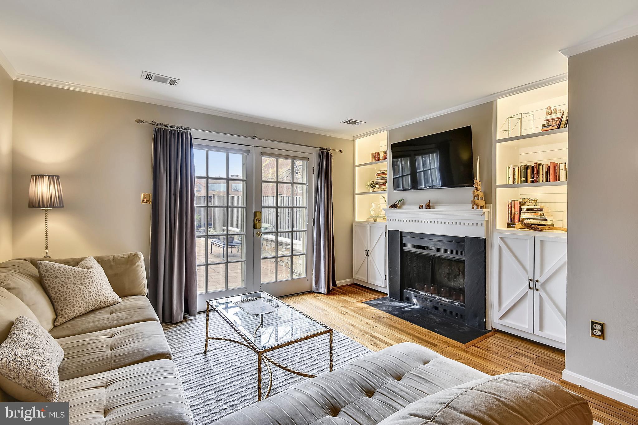 320 Commerce Street Alexandria, VA 22314 - Photo 9 of 30 Living Room w/french doors to patio