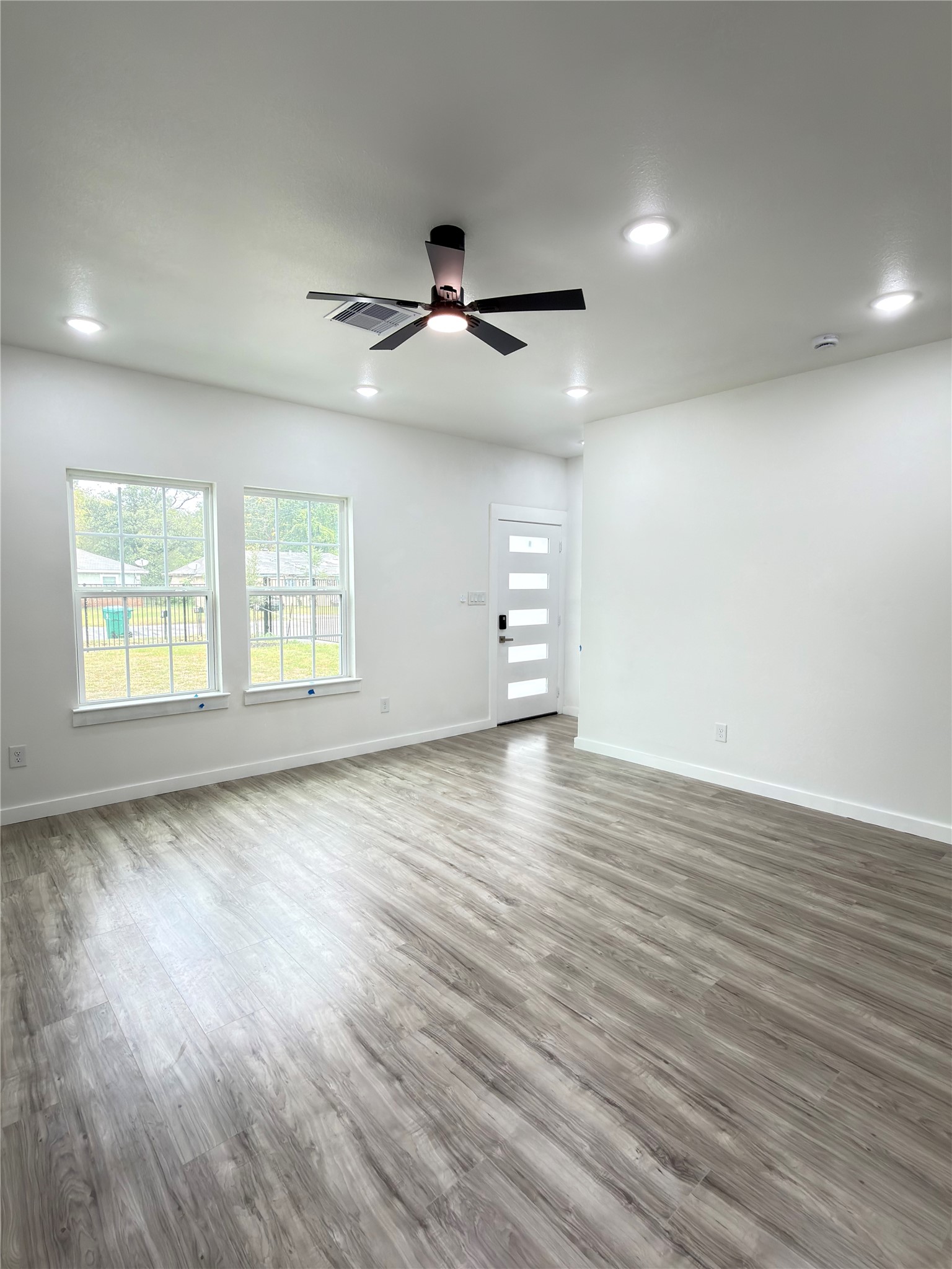 Modern open-concept kitchen seamlessly connects to the dining area, with the added convenience of a half bath on the main level.