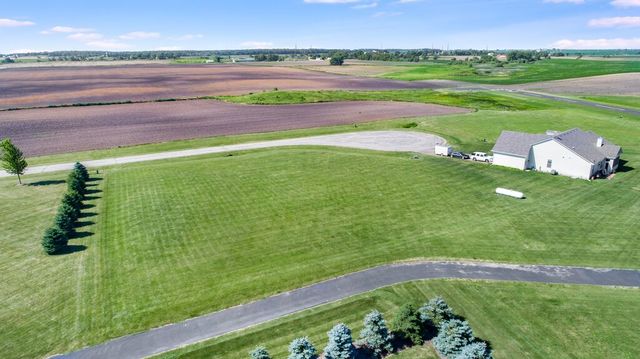 a view of a green field with clear sky