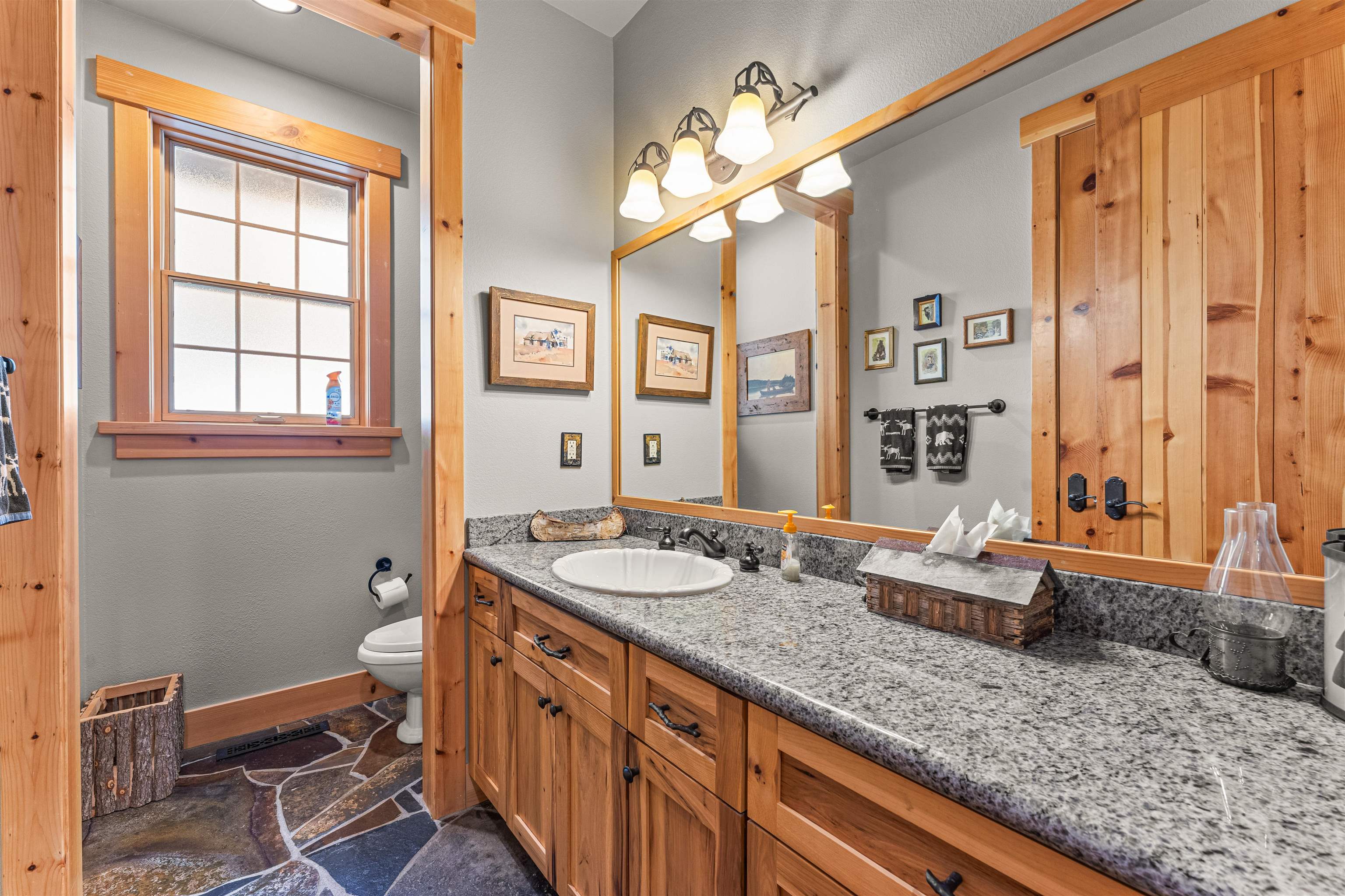 440 Valley Ranch Drive Clio, CA 96106 - Photo 12 of 50 a bathroom with a granite countertop sink a mirror and a bathtub
