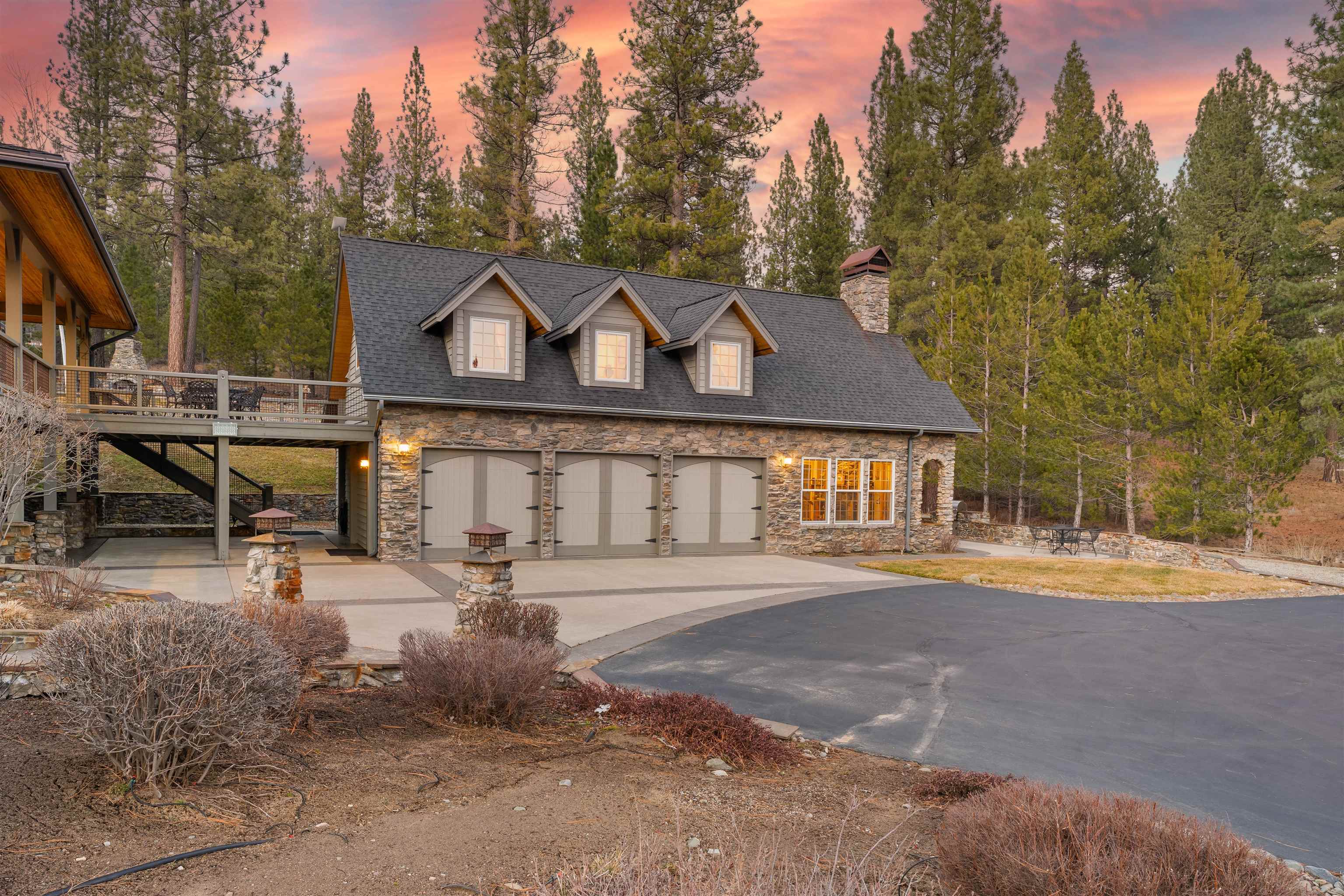 440 Valley Ranch Drive Clio, CA 96106 - Photo 22 of 50 a front view of a house with a garden and trees