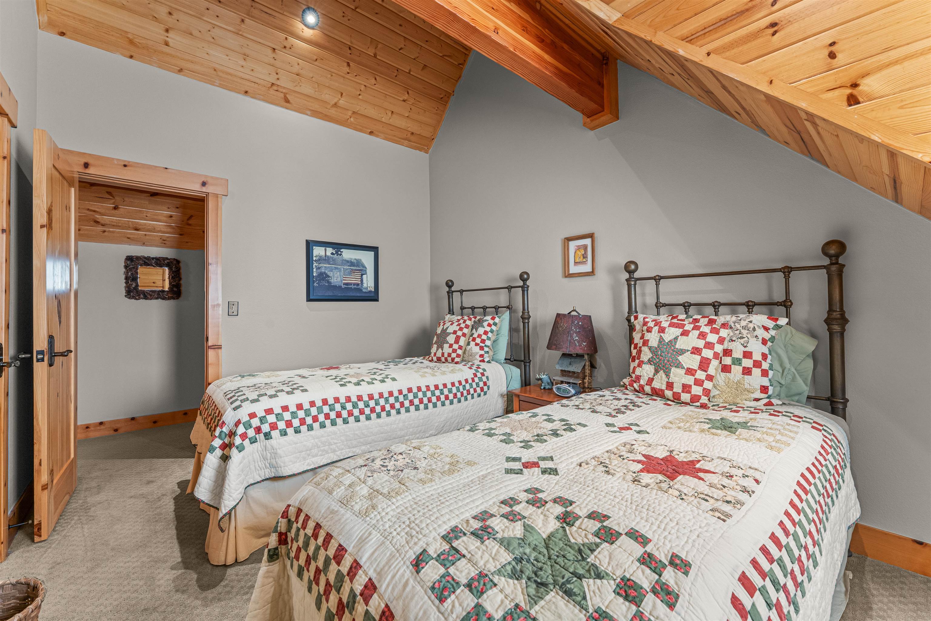 440 Valley Ranch Drive Clio, CA 96106 - Photo 27 of 50 a bedroom with a large bed and a night stand