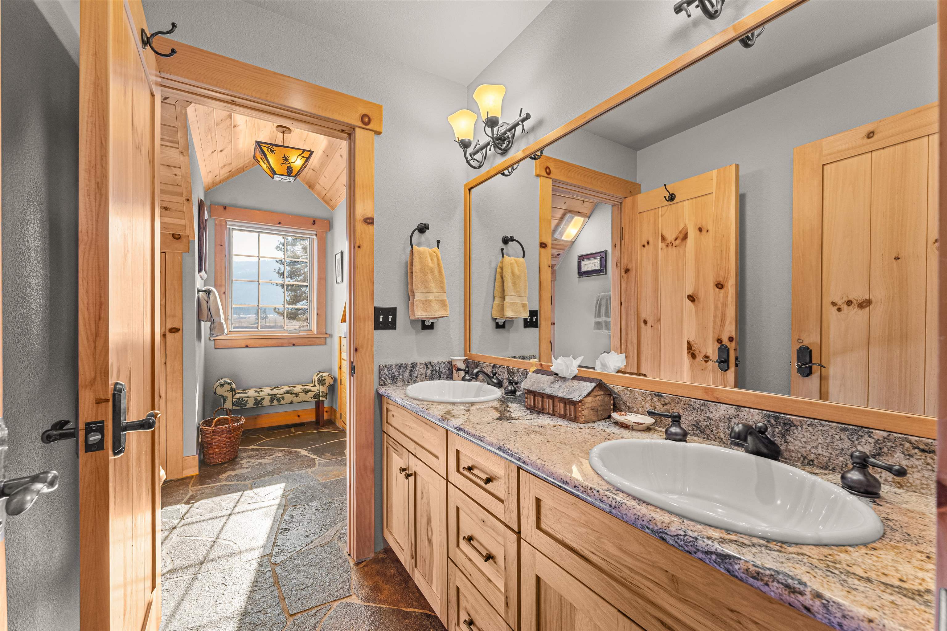 440 Valley Ranch Drive Clio, CA 96106 - Photo 28 of 50 a spacious bathroom with a sink double vanity and a mirror