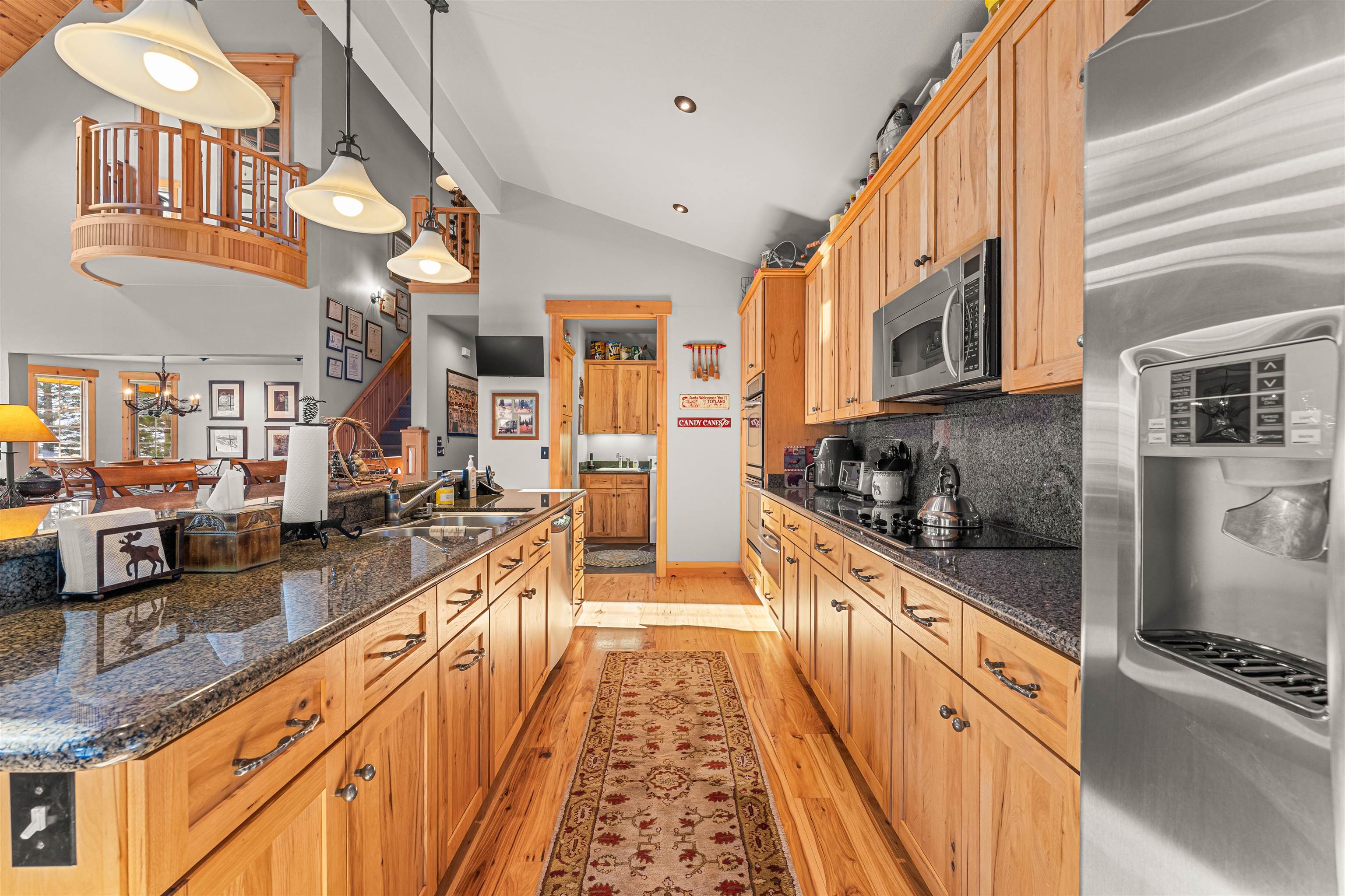 440 Valley Ranch Drive Clio, CA 96106 - Photo 8 of 50 a large kitchen with stainless steel appliances granite countertop a stove and a sink