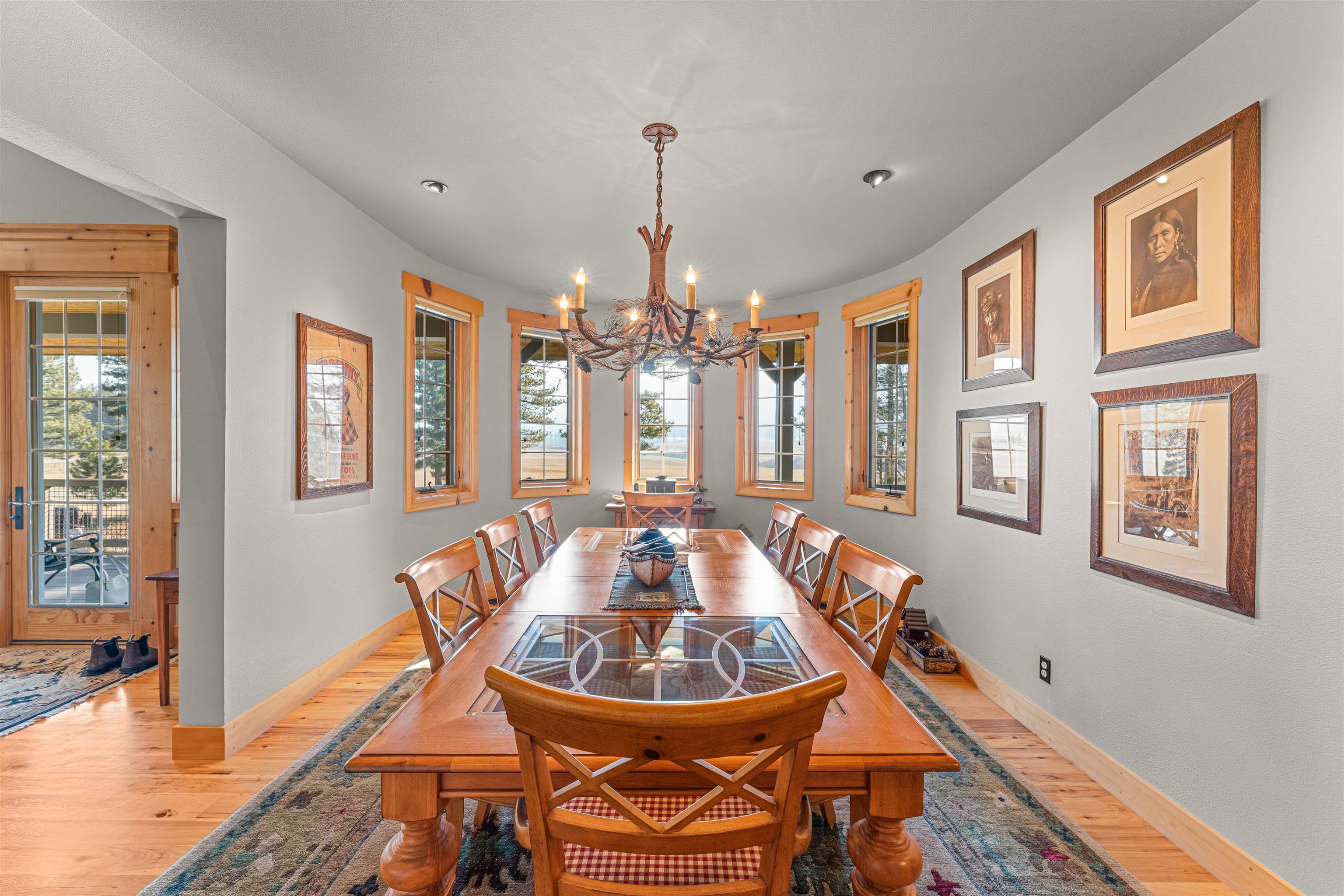 440 Valley Ranch Drive Clio, CA 96106 - Photo 9 of 50 a dining room with chandelier and wooden floor