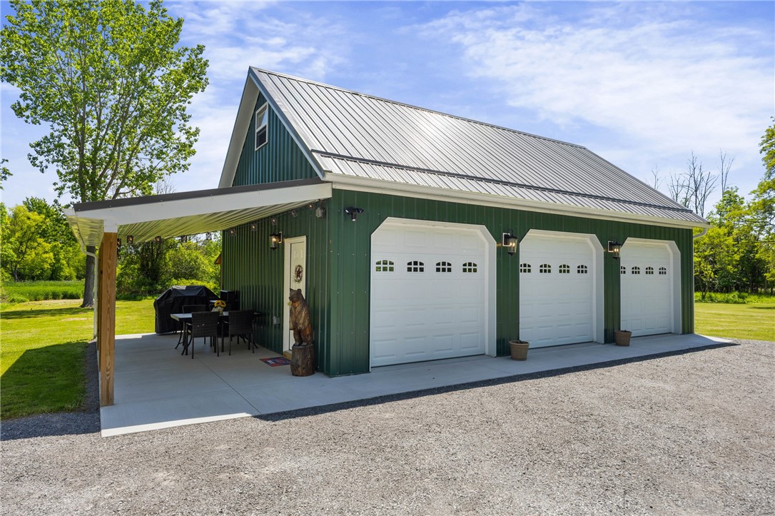 4581 Holley Byron Road Holley, NY 14470 - Photo 40 of 50 2025 garage with covered patio