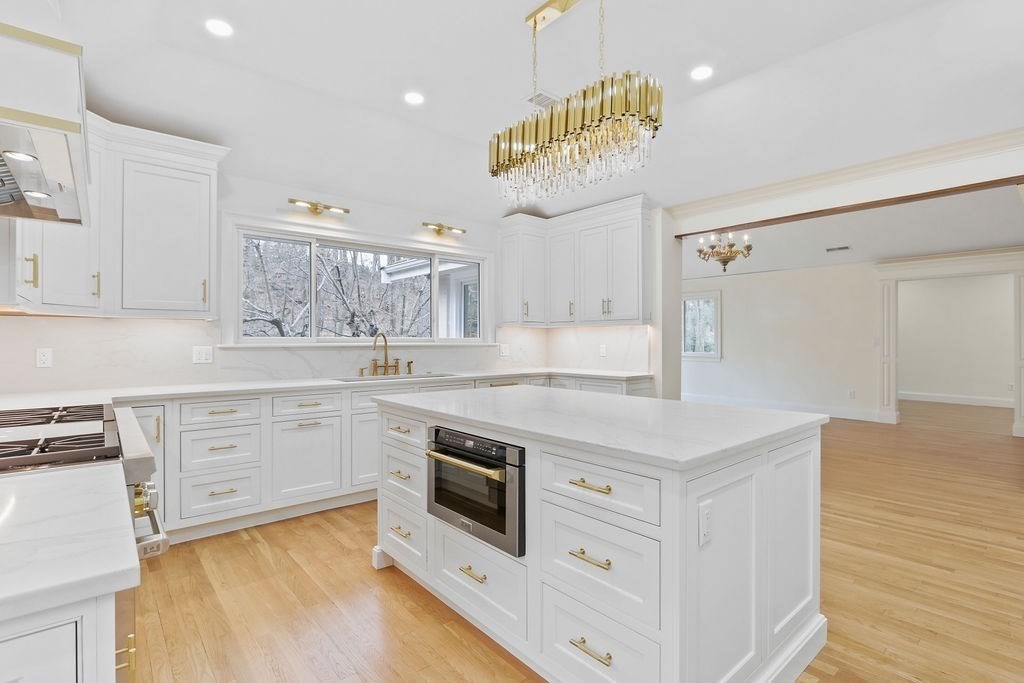 80 Doublet Hill Road Weston, MA 02493 - Photo 16 of 38 a kitchen with a stove cabinets and wooden floor