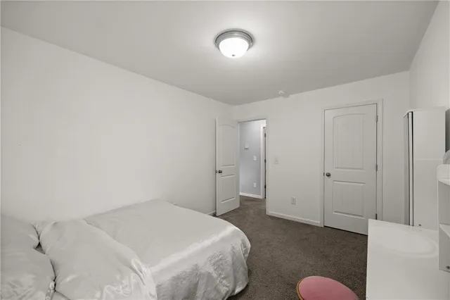 a bedroom with a bed and a cabinets