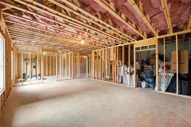 a balcony with table and chairs