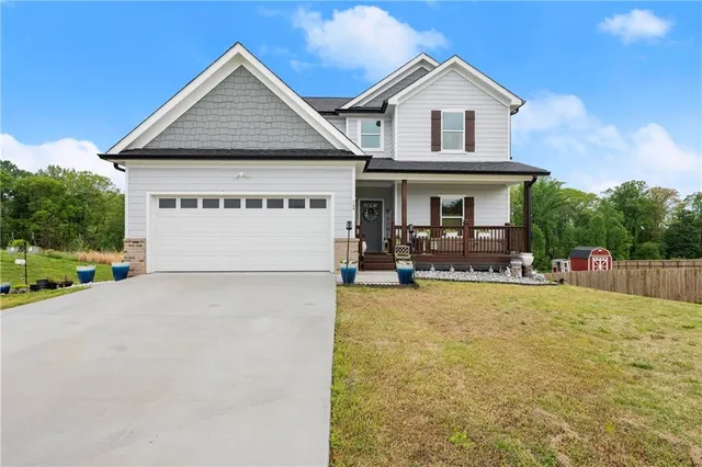 a view of house and outdoor space with yard