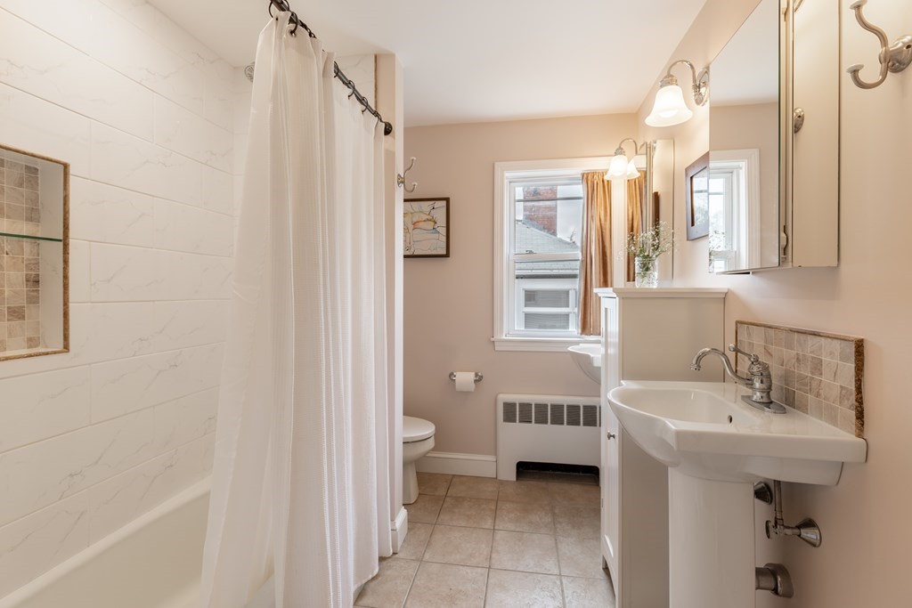 107 Oliver Road Waban, MA 02468 - Photo 15 of 32 a bathroom with a bathtub and a sink