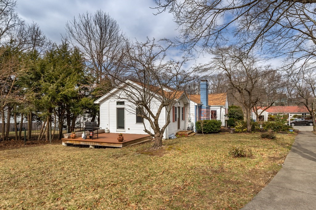 107 Oliver Road Waban, MA 02468 - Photo 27 of 32 a front view of a house with a yard