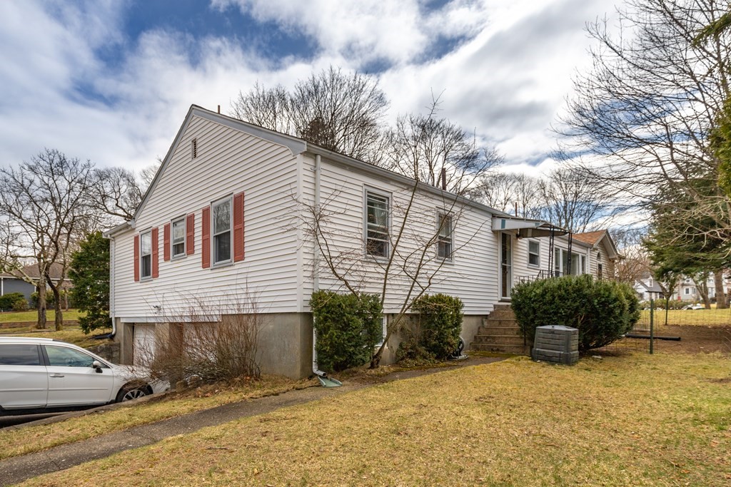 107 Oliver Road Waban, MA 02468 - Photo 29 of 32 a view of a house with a patio