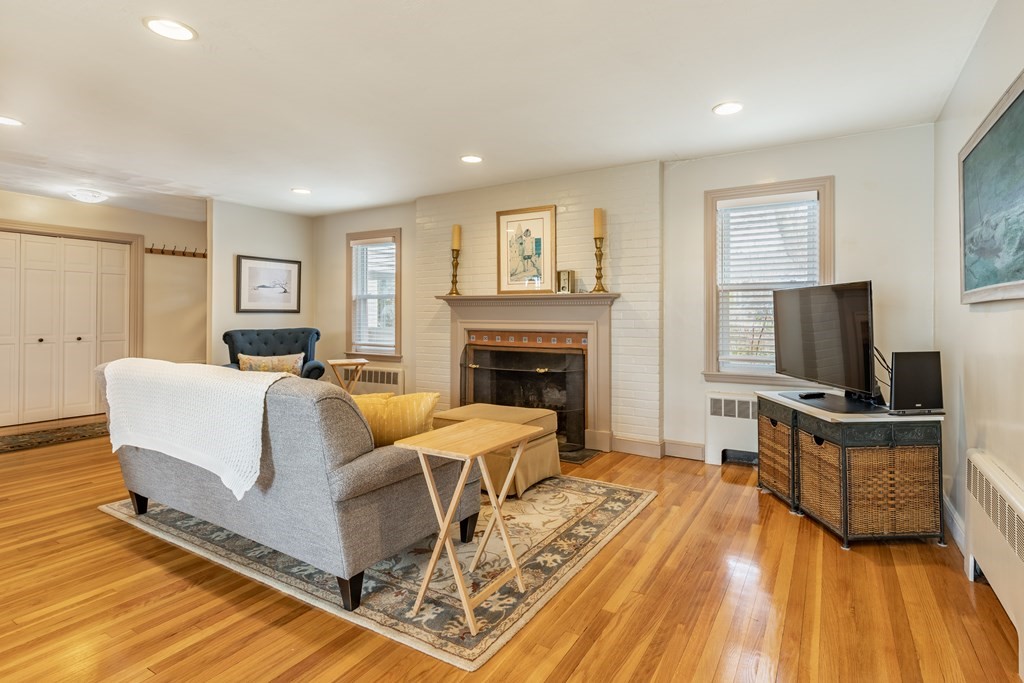 107 Oliver Road Waban, MA 02468 - Photo 4 of 32 a living room with furniture and a flat screen tv