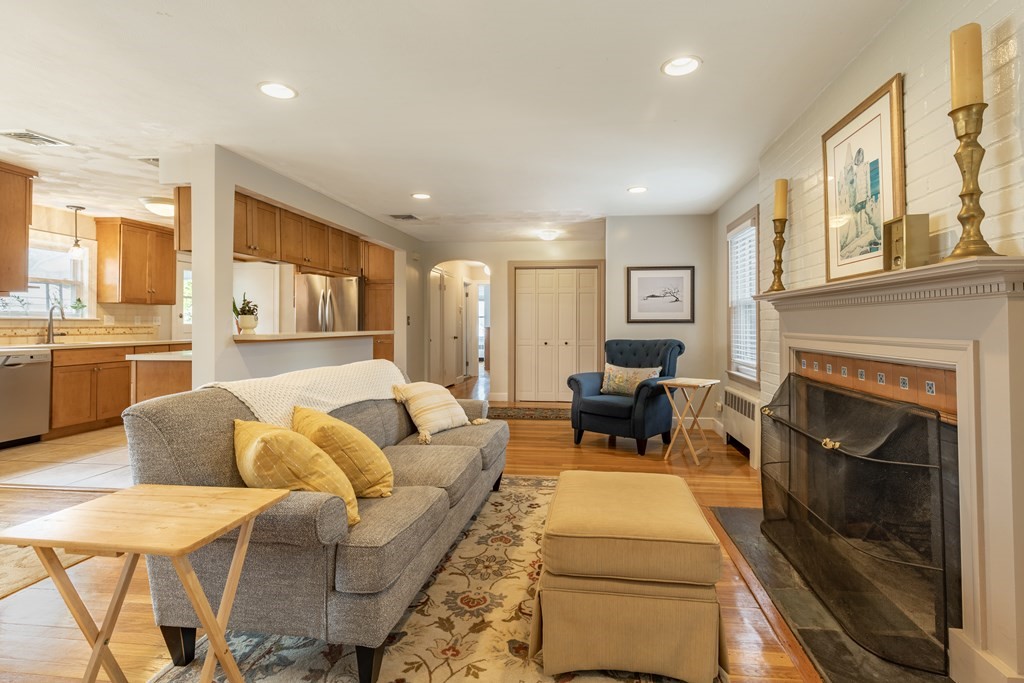 107 Oliver Road Waban, MA 02468 - Photo 5 of 32 a living room with furniture and a fireplace