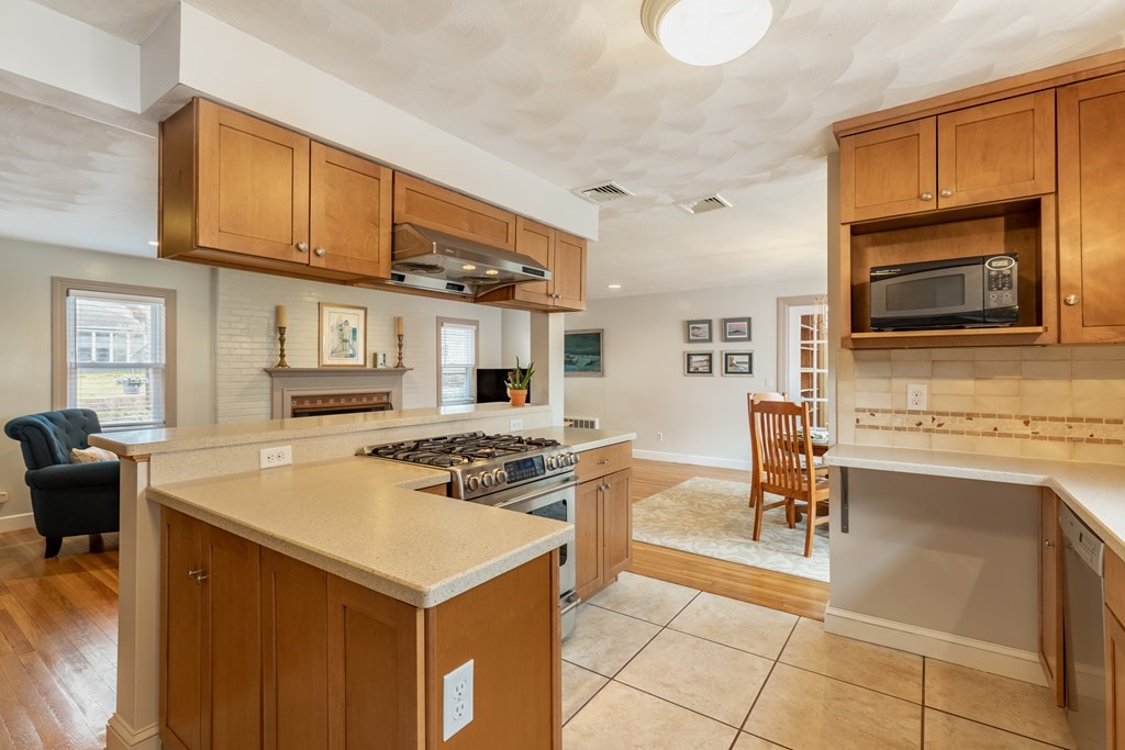 107 Oliver Road Waban, MA 02468 - Photo 8 of 32 a kitchen with a stove a sink and a microwave