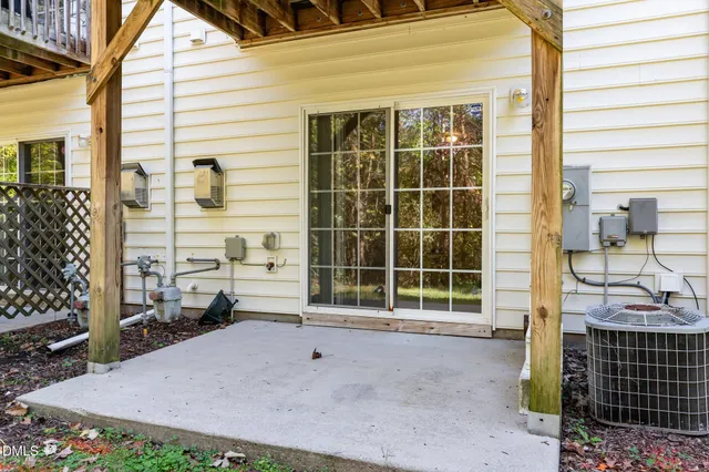 a view of a house with a backyard and a window